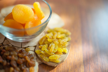 Raisins and dried apricots on the table