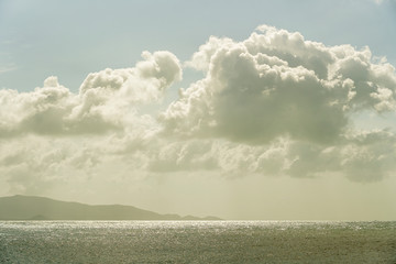 Obraz premium Blue sky with clouds over sea water. Nature composition.