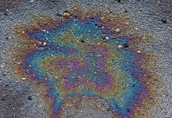 Oil stain on Asphalt, color Gasoline fuel spots on Asphalt Road as Texture or Background
