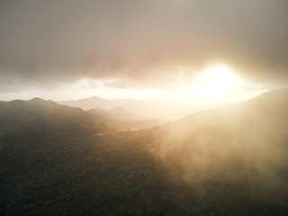 Foggy sunset over mountain