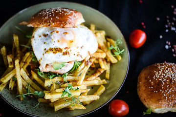 home made chicken burger with fried egg & french fries