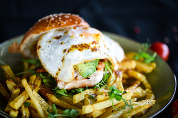 home made chicken burger with fried egg & french fries