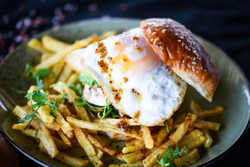 home made chicken burger with fried egg & french fries