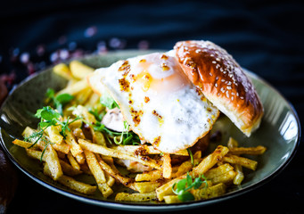 home made chicken burger with fried egg & french fries