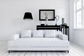 Wide white couch in front of lamp and table