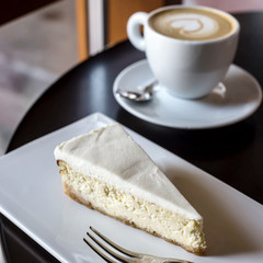 Coffee and dessert in a coffee shop for breakfast. City break concept