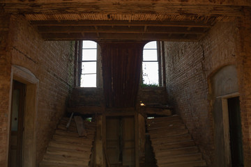 Fototapeta na wymiar stairs and windows of an abandoned house