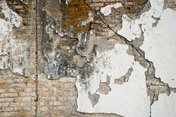 Destroyed plaster on brick wall texture