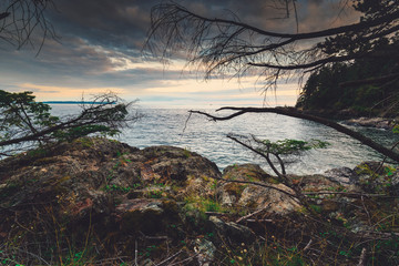 Sunset colours and rocky beaches with bluffs and cliffs in Apodaca Provincial Park on Bowen Island.  British Columbia Canada. Close to Vancouver.