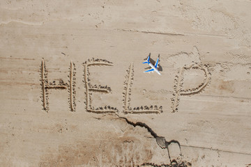 Help me the inscription and plane on the sand. Please help me. On a tropical beach