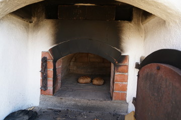 Freshly baked bread baked in a wood oven according to an old recipe wood stove