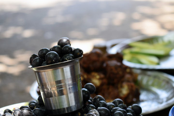 Picture black berries kept in a cup to sell in village