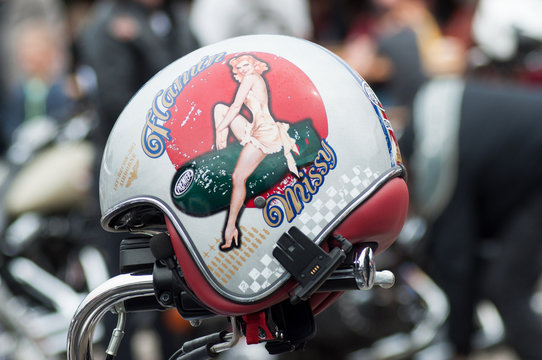  Closeup of pin up painting on motorbike helmet at fun car show event