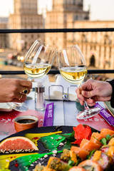 couple of girls in love celebrate with glasses of wine