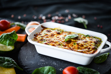 spinach lasagna with fresh vegetables