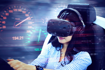 Young woman playing a virtual racing game