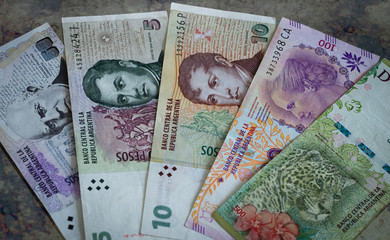 Argentine money. Banknotes of various denominations. Weakness of reality, State crisis, Concept. 