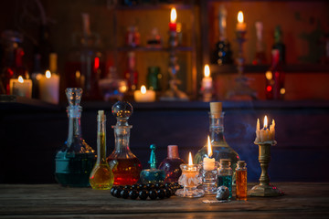 magic potions in bottles on wooden table