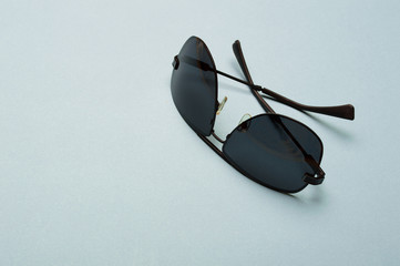 Stylish plastic dark sunglasses on colorful background. Eye care and diseases concept, eye...