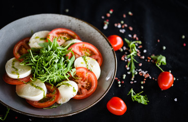 italian caprese salad with fresh mozzarella, tomatoes & basil