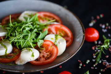 italian caprese salad with fresh mozzarella, tomatoes & basil