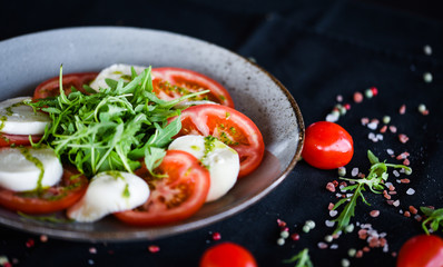 italian caprese salad with fresh mozzarella, tomatoes & basil