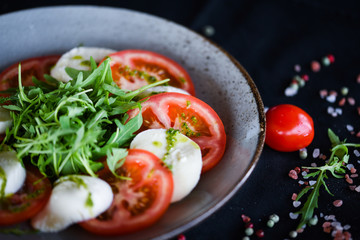 italian caprese salad with fresh mozzarella, tomatoes & basil