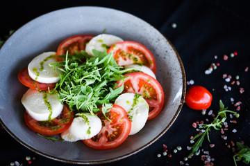 italian caprese salad with fresh mozzarella, tomatoes & basil