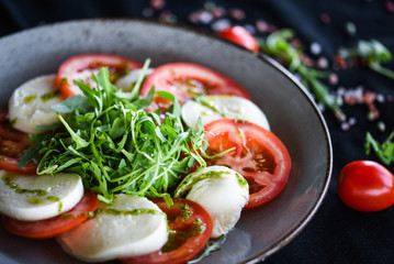 italian caprese salad with fresh mozzarella, tomatoes & basil