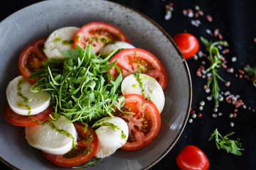 italian caprese salad with fresh mozzarella, tomatoes & basil