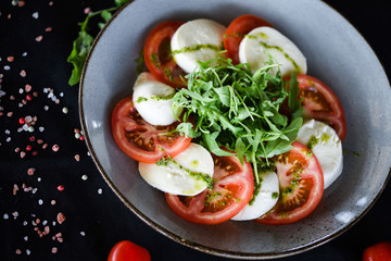 italian caprese salad with fresh mozzarella, tomatoes & basil