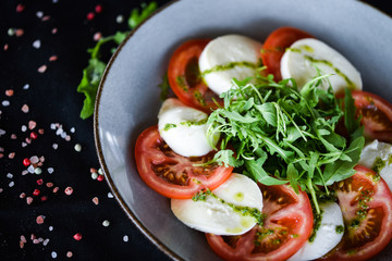 italian caprese salad with fresh mozzarella, tomatoes & basil