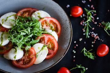 italian caprese salad with fresh mozzarella, tomatoes & basil