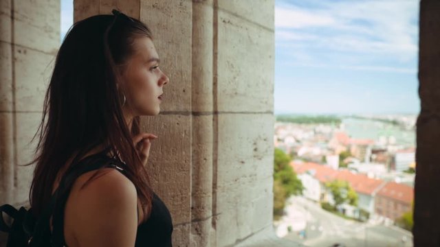 Close up young woman stand old arches on city street beautiful view attractive casual cell fashion smartphone happy portrait cute eyes girl looking model pretty sensuality slow motion