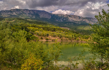 Fototapeta premium view of mountains and lake