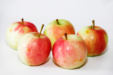natural yellow red autumn apples on a white background