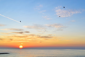 Alboraya,Valencia, Spain: 08.08.2019; The colorful sunrise on the sea beach
