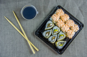 delivery of rolls at home. Sticks, soy sauce.