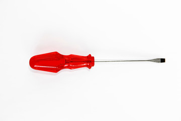 old rusty metal screwdriver for screws with red handle