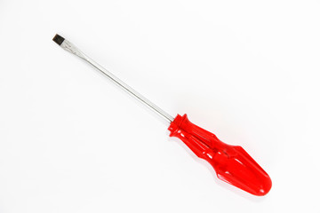 old rusty metal screwdriver for screws with red handle