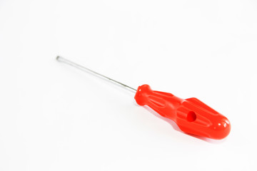 old rusty metal screwdriver for screws with red handle