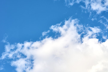 Blue sky with a white clouds, abstract background