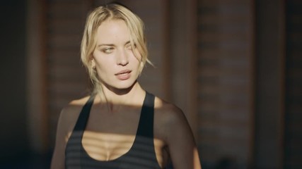 Closeup beautiful woman running on treadmill machine in fitness club.