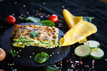 Fototapeta na wymiar italian lasagna slice with fresh ingredients