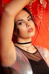 Fashion young woman with smooth armpit on red background