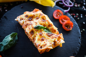 italian lasagna slice with fresh ingredients