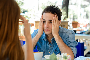 Young couple discussing.