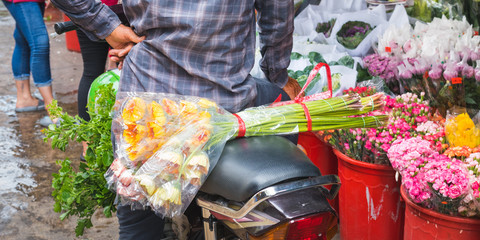 Ho Thi Ky Flower Market in Ho Chi Minh City (Saigon), Vietnam: a bouquet of flowers on a scooter...