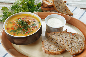 mashed soup with vegetables on a wooden table