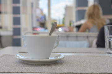 cup with coffee on the table